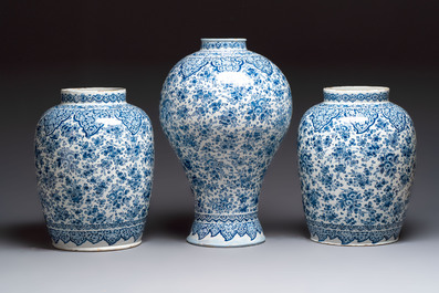 An exceptional large blue and white Dutch Delft garniture of three vases, late 17th/early 18th C.
