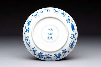 A Chinese blue and white 'Buddhist Symbols' plate, Chenghua mark, Kangxi