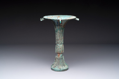 A Chinese archaic bronze wine vessel with 'taotie' design, 'gu 觚', Shang