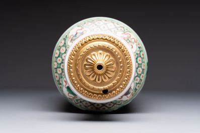 A fine Chinese famille verte 'Sanxing' rouleau vase with a gilt-bronze mount, Qing