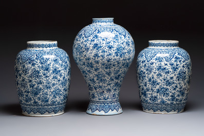 An exceptional large blue and white Dutch Delft garniture of three vases, late 17th/early 18th C.