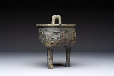 A Chinese archaic bronze food vessel with Taotie design, 'Ding 鼎', late Shang