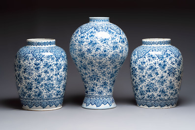 An exceptional large blue and white Dutch Delft garniture of three vases, late 17th/early 18th C.
