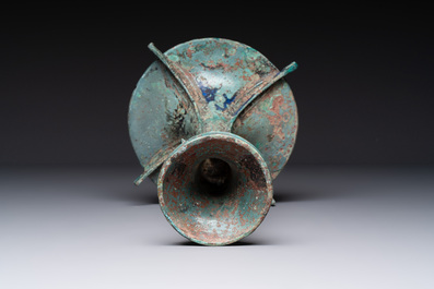 A Chinese archaic bronze wine vessel with 'taotie' design, 'gu 觚', Shang