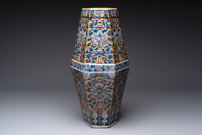 A rare Chinese hexagonal copper-red, blue and white brown-ground vase, 19th C.