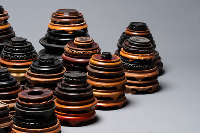 A large collection of 100 Chinese wooden stands, 19/20th C.
