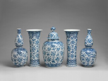 An exceptional large blue and white Dutch Delft garniture of three vases, late 17th/early 18th C.
