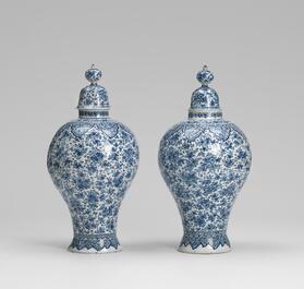 An exceptional large blue and white Dutch Delft garniture of three vases, late 17th/early 18th C.