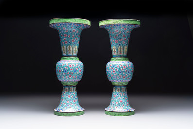 A pair of Chinese Canton enamel 'gu' vases with floral design, Qianlong