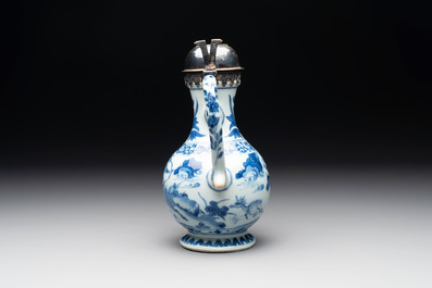 A Chinese silver-mounted blue and white 'Mongolian hunt' ewer, Transitional period