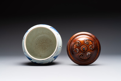 A Chinese blue and white 'qilin' jar and wooden cover, Transitional period