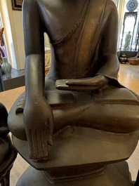 A large and fine Burmese bronze Buddha with two servants, 16/17th C.