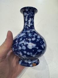 A pair of Nevers white-splashed blue-ground '&agrave; la bougie' vases, France, late 17th C.