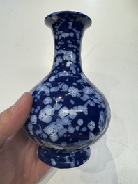 A pair of Nevers white-splashed blue-ground '&agrave; la bougie' vases, France, late 17th C.