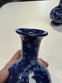 A pair of Nevers white-splashed blue-ground '&agrave; la bougie' vases, France, late 17th C.