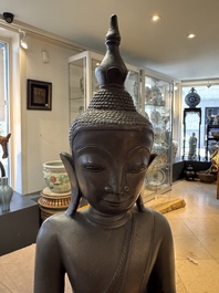 A large and fine Burmese bronze Buddha with two servants, 16/17th C.