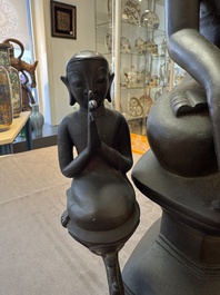 A large and fine Burmese bronze Buddha with two servants, 16/17th C.