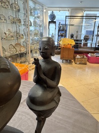 A large and fine Burmese bronze Buddha with two servants, 16/17th C.