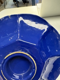 A Nevers white-splashed blue-ground '&agrave; la bougie' dish, France, late 17th C.
