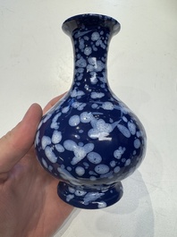 A pair of Nevers white-splashed blue-ground '&agrave; la bougie' vases, France, late 17th C.