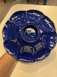 A Nevers white-splashed blue-ground '&agrave; la bougie' dish, France, late 17th C.