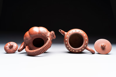 Seven Chinese Yixing stoneware teapots, two cups and a covered box, 20th C.