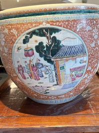 A large Chinese famille rose coral-red-ground fish bowl with narrative design, 19th C.