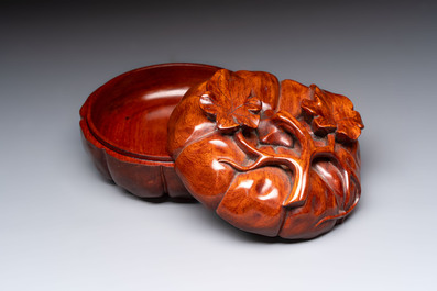 12 various Chinese carved huali and hongmu fruit-form covered boxes, 20th C.