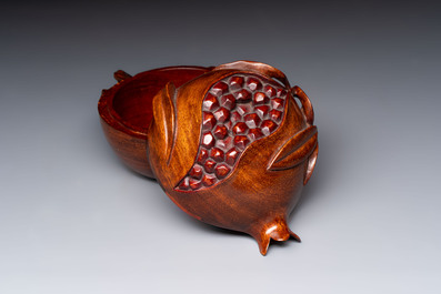 12 various Chinese carved huali and hongmu fruit-form covered boxes, 20th C.