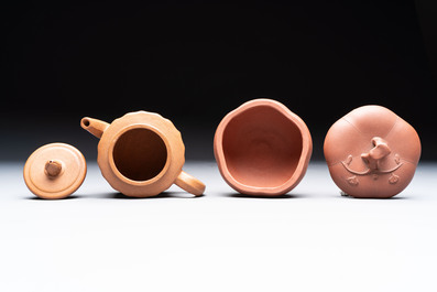 Seven Chinese Yixing stoneware teapots, two cups and a covered box, 20th C.