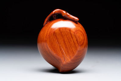 12 various Chinese carved huali and hongmu fruit-form covered boxes, 20th C.