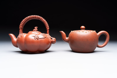 Seven Chinese Yixing stoneware teapots, two cups and a covered box, 20th C.