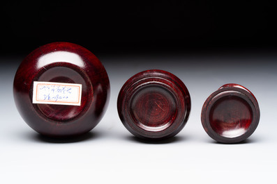 12 various Chinese carved huali and hongmu fruit-form covered boxes, 20th C.