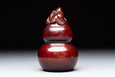 12 various Chinese carved huali and hongmu fruit-form covered boxes, 20th C.