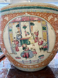 A large Chinese famille rose coral-red-ground fish bowl with narrative design, 19th C.