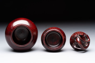 12 various Chinese carved huali and hongmu fruit-form covered boxes, 20th C.