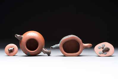 Seven Chinese Yixing stoneware teapots, two cups and a covered box, 20th C.