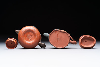 Seven Chinese Yixing stoneware teapots, two cups and a covered box, 20th C.