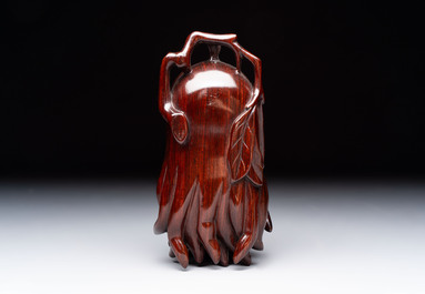 12 various Chinese carved huali and hongmu fruit-form covered boxes, 20th C.