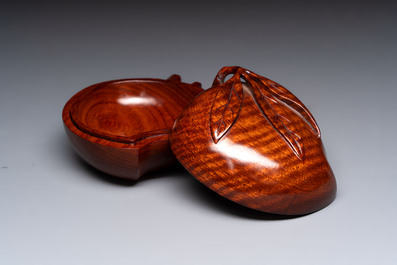 12 various Chinese carved huali and hongmu fruit-form covered boxes, 20th C.