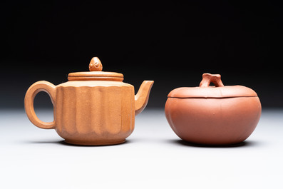 Seven Chinese Yixing stoneware teapots, two cups and a covered box, 20th C.