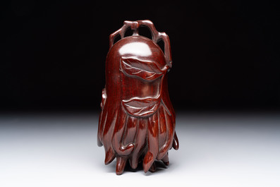 12 various Chinese carved huali and hongmu fruit-form covered boxes, 20th C.