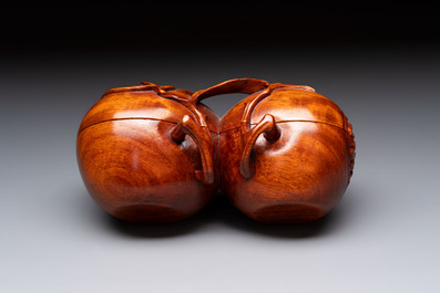 12 various Chinese carved huali and hongmu fruit-form covered boxes, 20th C.