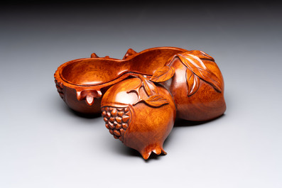 12 various Chinese carved huali and hongmu fruit-form covered boxes, 20th C.