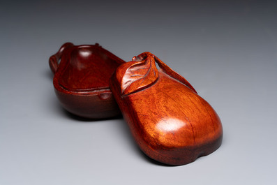 12 various Chinese carved huali and hongmu fruit-form covered boxes, 20th C.