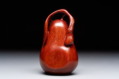 12 various Chinese carved huali and hongmu fruit-form covered boxes, 20th C.