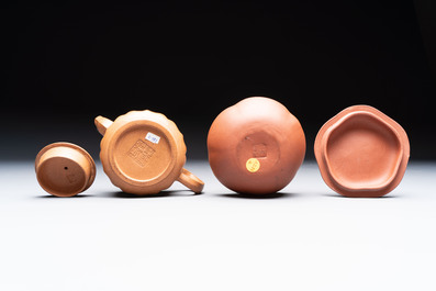 Seven Chinese Yixing stoneware teapots, two cups and a covered box, 20th C.
