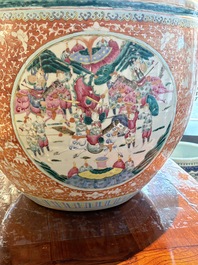 A large Chinese famille rose coral-red-ground fish bowl with narrative design, 19th C.