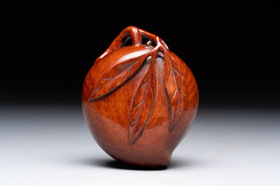 12 various Chinese carved huali and hongmu fruit-form covered boxes, 20th C.