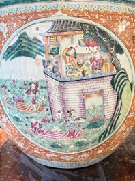 A large Chinese famille rose coral-red-ground fish bowl with narrative design, 19th C.